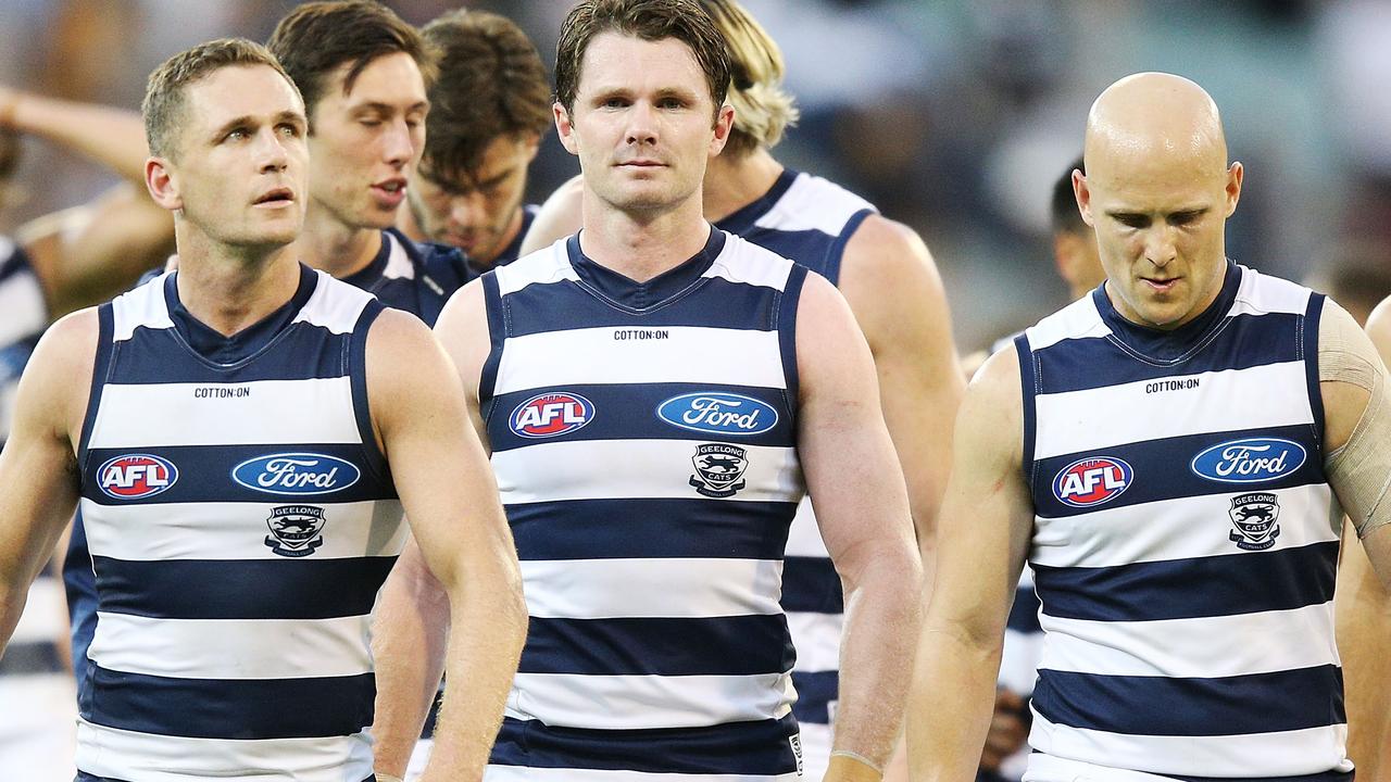 MELBOURNE, AUSTRALIA - APRIL 02:  Joel Selwood of the Cats (L) Patrick Dangerfield (C) and Gary Ablett looks dejected walking off after defeat during the round two AFL match between the Geelong Cats and the Hawthorn Hawks at Melbourne Cricket Ground on April 2, 2018 in Melbourne, Australia.  (Photo by Michael Dodge/Getty Images)