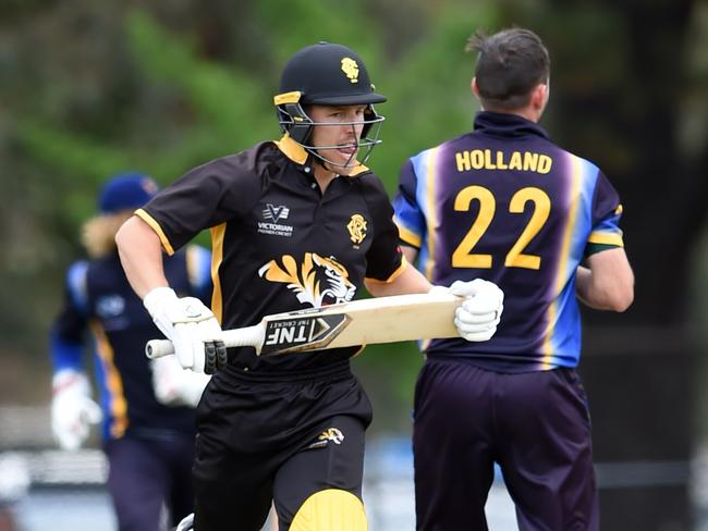 Premier Cricket: Monash Tigers versus Ringwood at Central Reserve, Glen Waverley. Ringwood bowler Holland (22) and Tigers batsman Sartori (25).