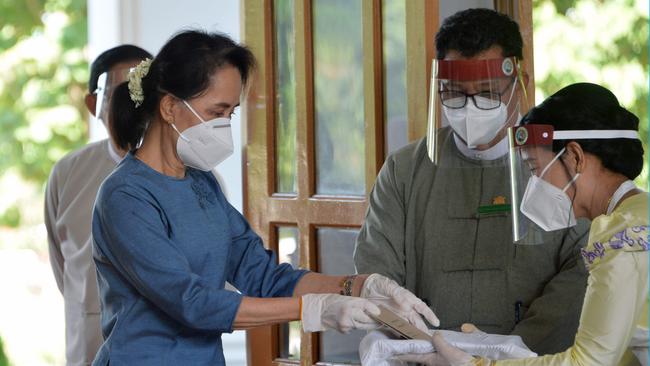 Aung San Suu Kyi arrives to cast a pre-poll vote at a polling station in Naypyidaw last week. Picture: AFP