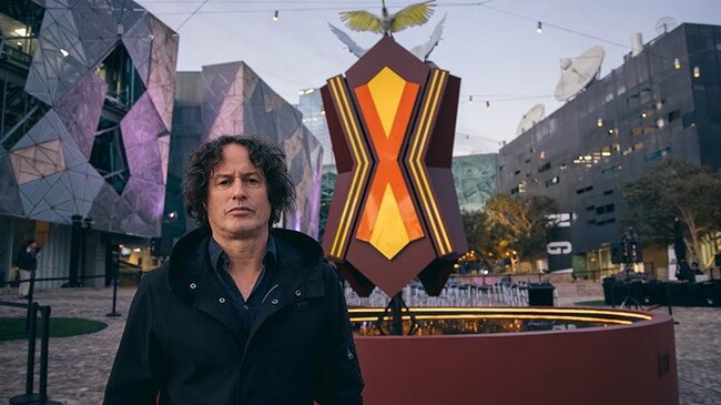 Indigenous artist Kent Morris in front of his sculpture Unvanished, recently displayed at Fed Square. Picture: Supplied.