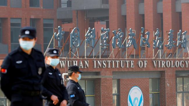 Security personnel keep watch outside the Wuhan Institute of Virology during the visit by the World Health Organisation in 2021. Picture: Reuters