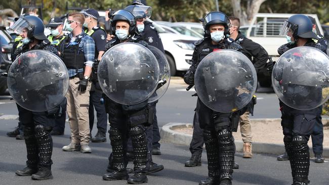 Riot police arrive in Northcote. Picture: David Crosling