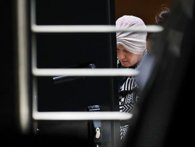 Malka Leifer is taken from the North Melbourne police station after a hearing in 2021. Picture: David Crosling