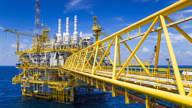 Oil and Gas production platform in blue sky located at the gulf of Thailand.