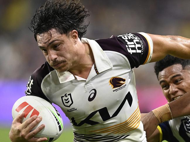 TOWNSVILLE, AUSTRALIA - AUGUST 10: Kotoni Staggs of the Broncos is tackled during the round 23 NRL match between North Queensland Cowboys and Brisbane Broncos at Qld Country Bank Stadium, on August 10, 2024, in Townsville, Australia. (Photo by Ian Hitchcock/Getty Images)