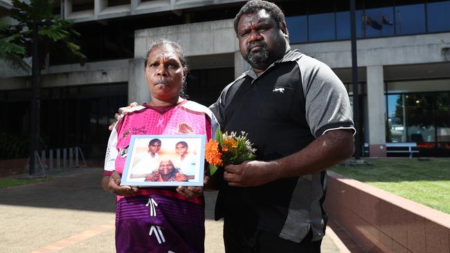 Allison Bernard's mother and uncle Edwina Bernard and Teddy Bernard, pictured with a photo of Ms Bernard (left) with her grandmother and sister. The pair were in the Cairns Coroner's Court on the first day of the coronial inquest into Ms Bernard's disappearance. Picture: Brendan Radke