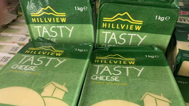 The green and gold packaging of Woolworths Hillview cheese.