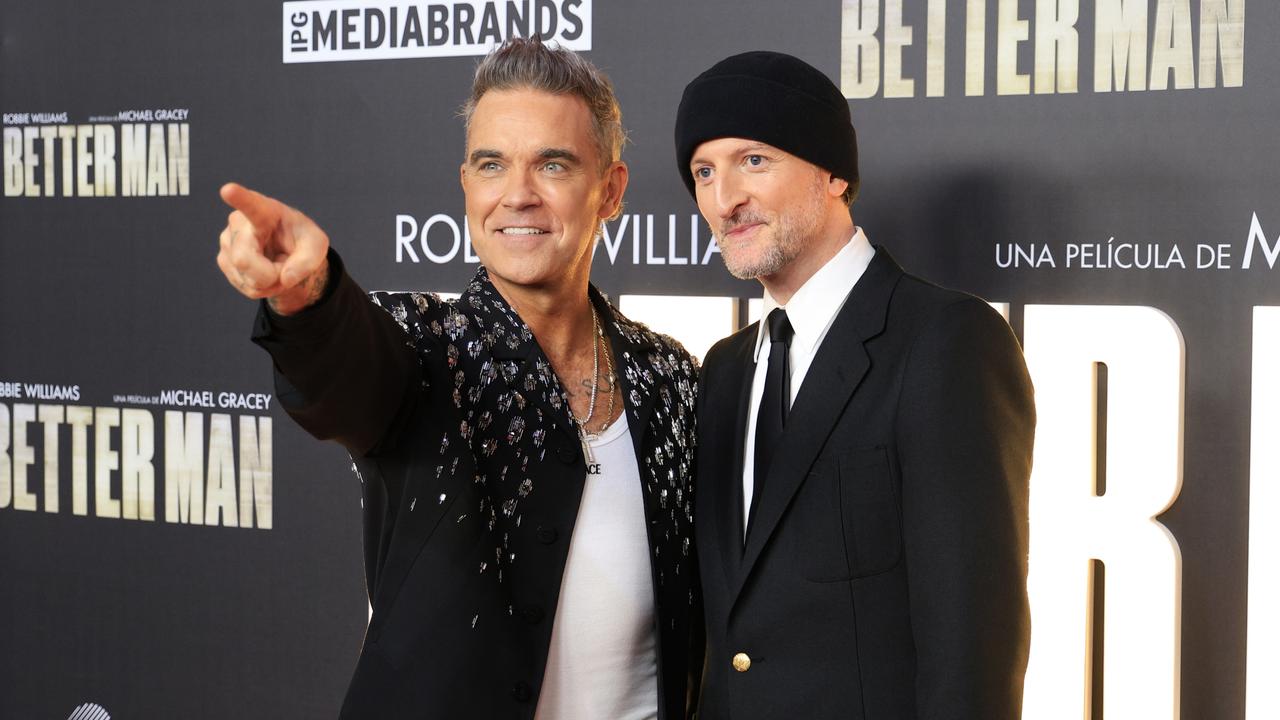 Robbie Williams and Michael Gracey at the Better Man premiere in Madrid on December 4. Picture: Manuel Pinilla Cruces via Getty Images.