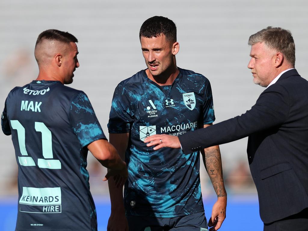 Sydney FC coach Ufuk Talay (right) gives some instructions to Sky Blues pair Jordan Courtney-Perkins (centre) and Robert Mak. Picture: Fiona Goodall/Getty Images