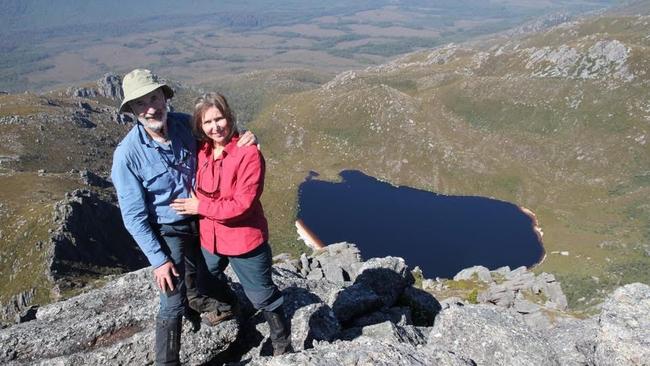 Peter, a nature writer/blogger and former Parks and Wildlife Service staffer, and Lynne Grant atop Reeds Peak overlooking Lake Rhona. Picture: Supplied 