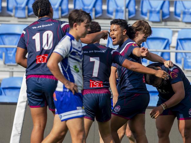 The Grand Final of the Qld schoolboys rugby league competition with Ipswich SHS (Dark blue jersey) playing against Ignatius Park College (white/blue jersey) in the Phil Hall Cup grand final at Cbus Super Stadium on 31 August 2022.  Ipswich SHS's Tre Fotu  and team mates celebrate after scoring a try .Picture: Jerad Williams