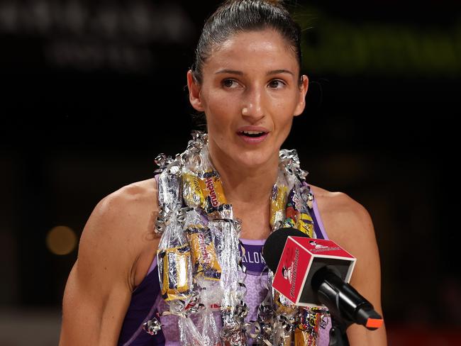 ADELAIDE, AUSTRALIA - APRIL 13: Kim Ravaillion celebrates her 150th SSN match of the Queensland Firebirds during the round one Super Netball match between Adelaide Thunderbirds and Queensland Firebirds at Adelaide Entertainment Centre, on April 13, 2024, in Adelaide, Australia. (Photo by Maya Thompson/Getty Images)