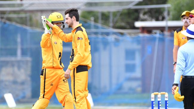 Glenelg keeper Josh Roach and Harry Cunningham celebrate a wicket. The pair held the Seahorses’ batting innings together. Picture: AAP/Keryn Stevens