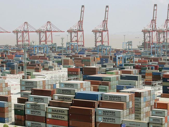 ** FILE ** In this June 9, 2005 file photo, containers are piled up at Ningbo Port in Ningbo, China. China's June global trade surplus fell 20 percent from the same month last year as export growth slowed amid weaker global demand but the surplus with the United States and Europe grew, according to data reported Thursday, July 10, 2008. (AP Photo/Eugene Hoshiko, FILE)