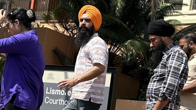 Lovepreet Singh, (in orange turban) with support leaving Lismore Courthouse. He remains on bail after pleading not guilty to the car crash death of a Lindendale farmer in January, 2022.