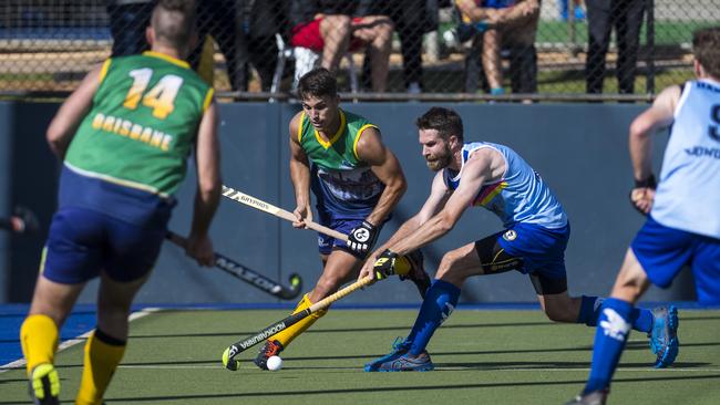 Joel Rintala, middle in green, eyes the ball playing at the Hockey Queensland Championships earlier in the year.Picture: Kevin Farmer