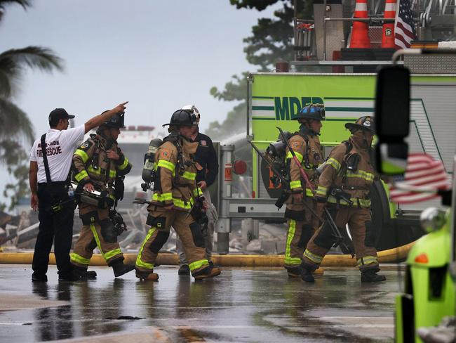 Miami-Dade Fire Rescue personnel continue search and rescue operations in the partially collapsed 12-storey Champlain Towers South condo building.