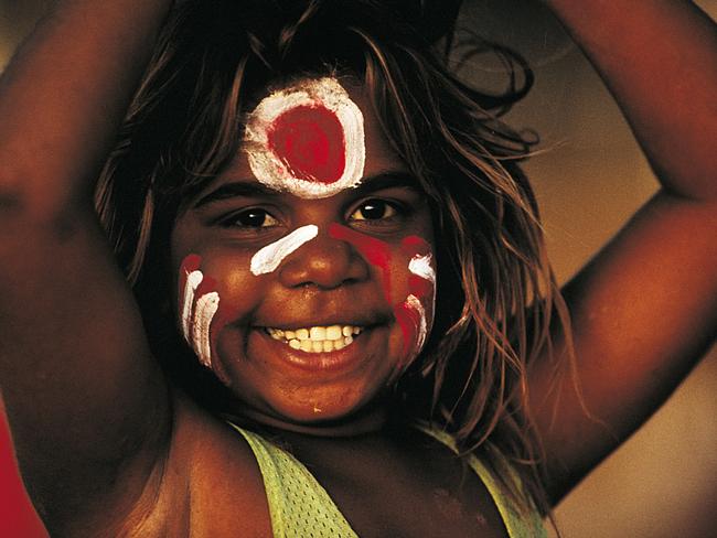 A Portrait of Australia: The best stories from 30 years of Australian Geographic. The people of the Tanami The face of Carol Green Napangardi painted in the colours of her local footy team at Lajamanu on the Tanami Road. Photo by Bill Bachman