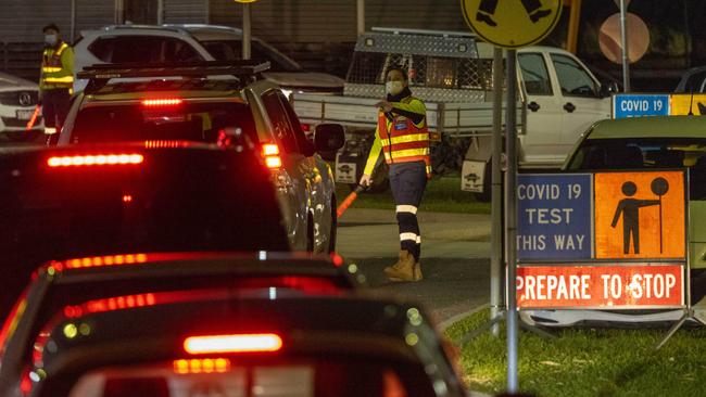 Cars queue up at the Northern Hospital testing site in Epping on Monday night. Picture: Wayne Taylor