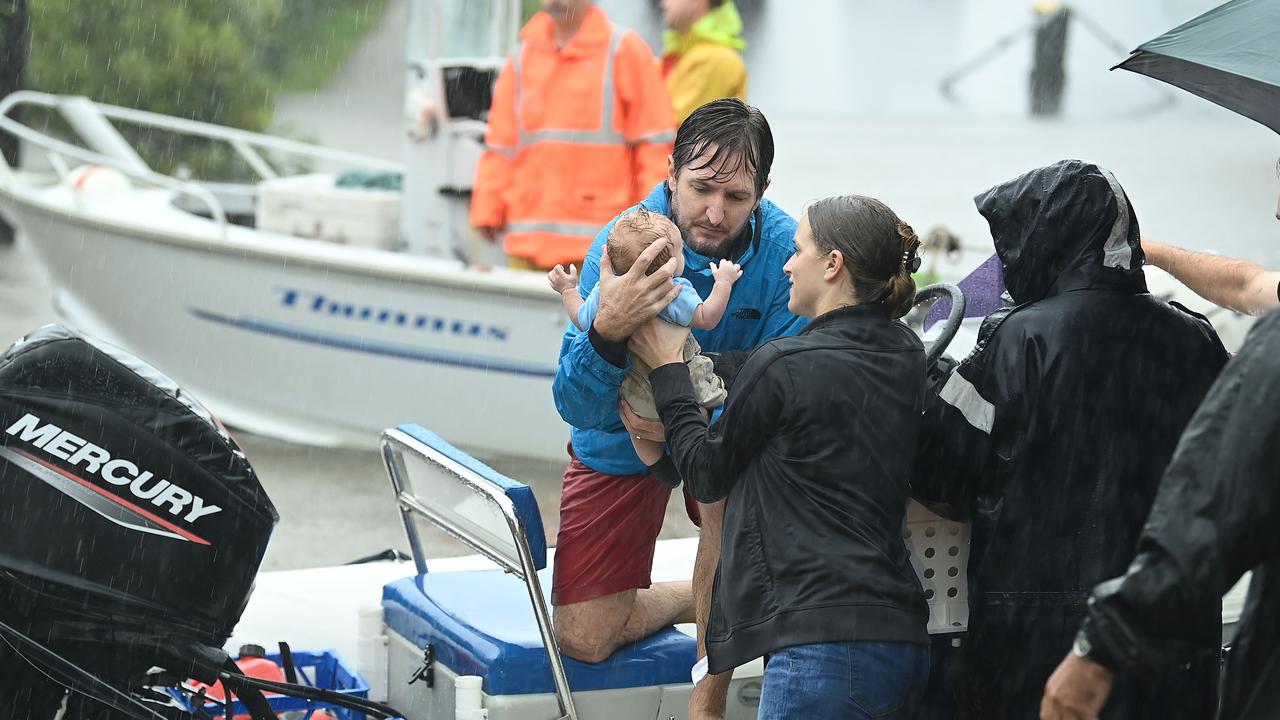 Race for high ground as Queensland deluge hits | The Australian