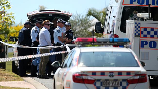 Queensland Police and forensic officers pictured outside a home in The Gap after a body was discovered early this morning. Picture: Jack Tran