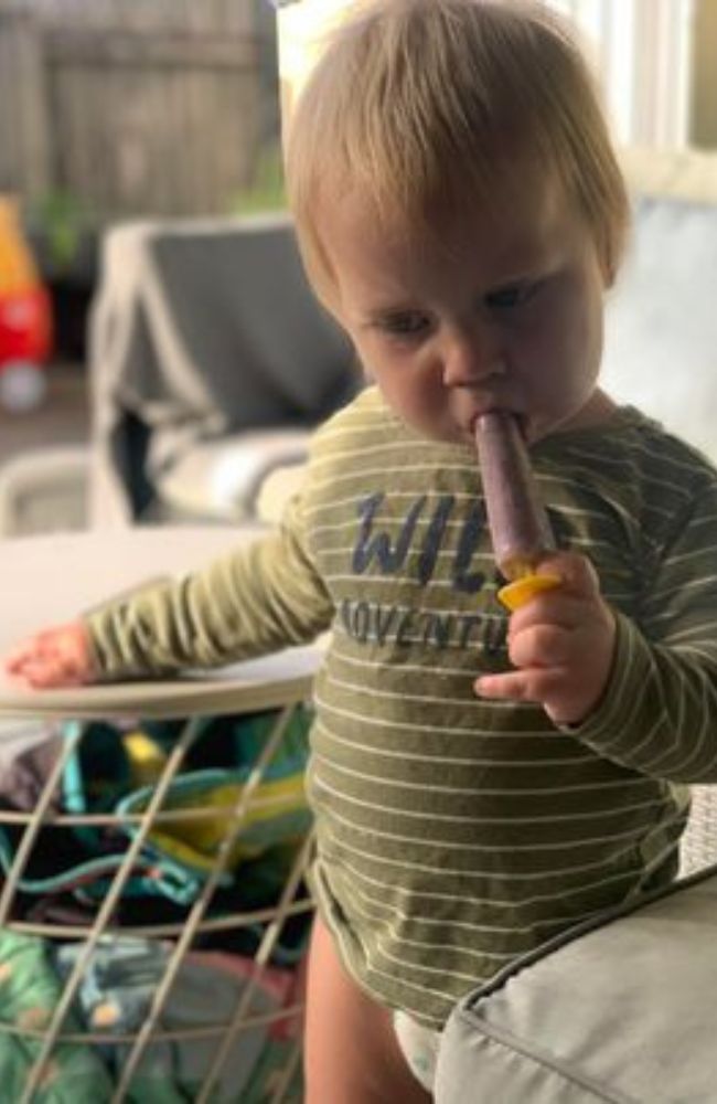 One of Izabelle's children eating an ice block containing desiccated organs. Picture: Supplied