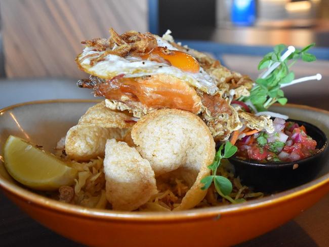 Nasi Goreng is served at Breakers Country Club with crispy fried soft shell crab at Breakers Country Club.