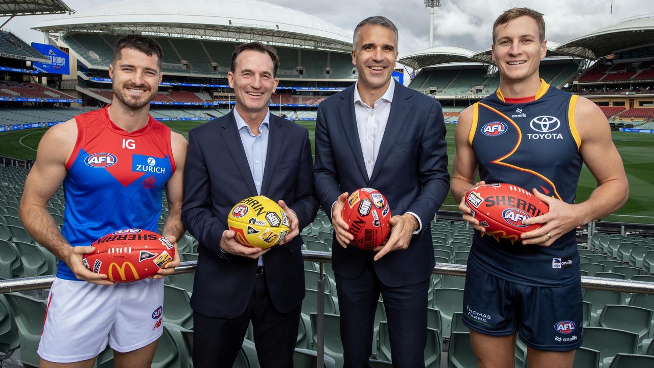 ADELAIDE, AUSTRALIA - APRIL 03: Alex Neal-Bullen of the Demons, AFL CEO Andrew Dillon, The Hon Peter Malinauskas MP,Premier of South Australia and Jordan Dawson of the Crows pose for a photo during a 2024 AFL Gather Round Media Opportunity at the Adelaide Oval on April 03, 2024 in Adelaide, Australia. (Photo by Mark Brake/AFL Photos/via Getty Images)