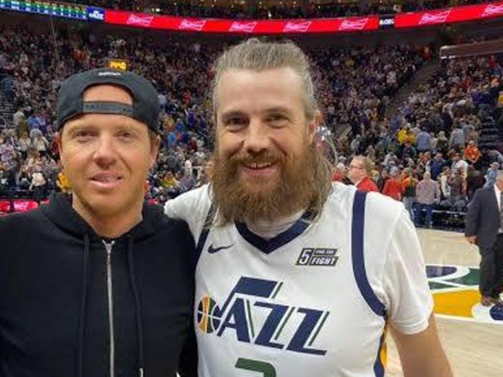 Mike Cannon-Brookes (right) with Ryan Smith at a Jazz game.