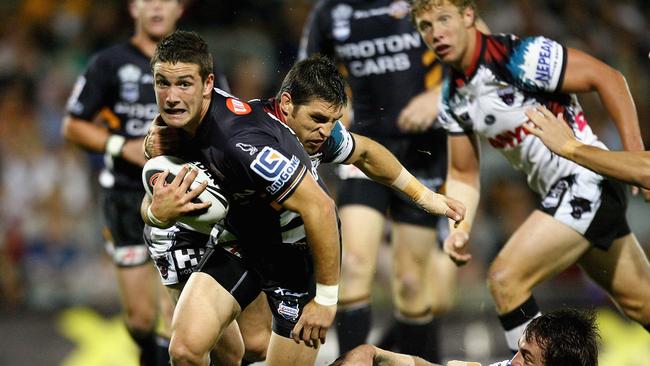 SYDNEY, AUSTRALIA — APRIL 07: Tim Moltzen of the Tigers makes a line break during the round four NRL match between the Wests Tigers and the Penrith Panthers at Campbelltown Sports Stadium on April 7, 2008 in Sydney, Australia. (Photo by Mark Nolan/Getty Images)