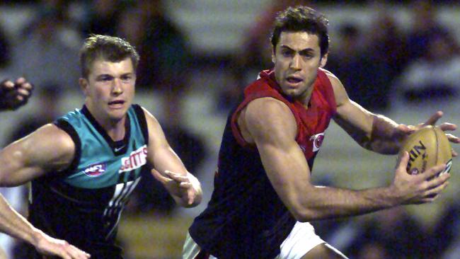 D/IFootballer Craig Ellis with Scott Bassett. AFL football - Melbourne vs Port Adelaide Power match at AAMI Stadium 27 Jul 2002. a/ct /Football/AFL