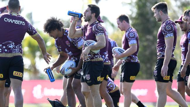 Ben Hunt (centre) takes a drink during Queensland’s opposed session.