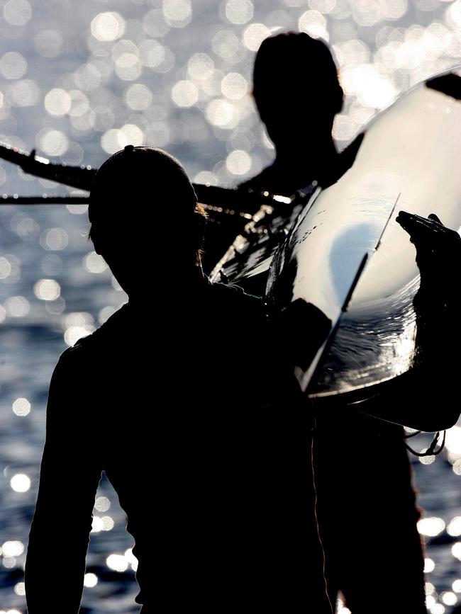 Hutchins School junior rowers Jono Hookway, left, and Adam Wertheimer to represent Australia at the world junior championships in Amsterdam train on the Derwent *** silhouette ***