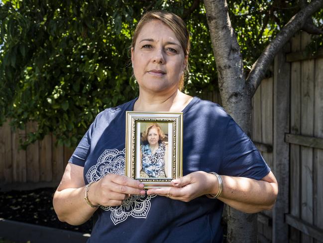 Kathy Bourinaris holds a picture of her mother Fotini Atzarakis, 77, who died at Epping Gardens. Picture: Jake Nowakowski