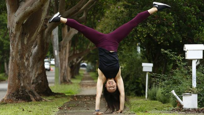 Kylie Simpson shows off her tumbling skills outside her parents’ South Penrith home. Picture: John Appleyard
