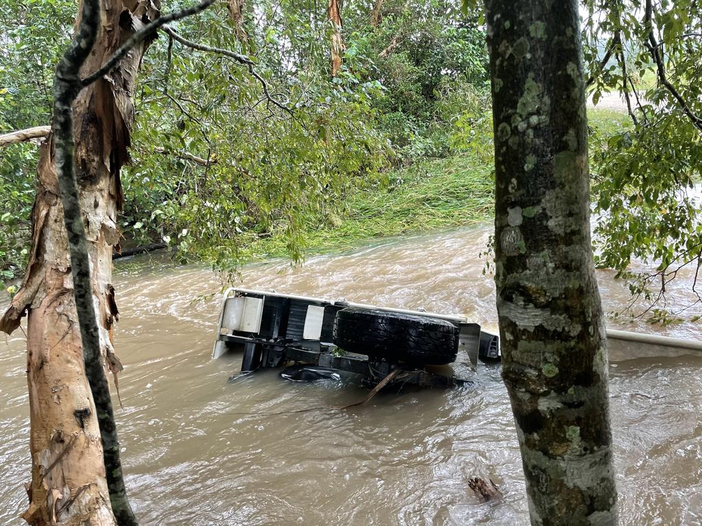 The submerged vehicle in Surprise Creek Road at Mount Ossa where a Calen woman was found inside. Picture: Max O'Driscoll