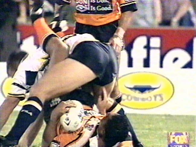 ohn Hopoate poking the bottom of a Cowboys player in 2001