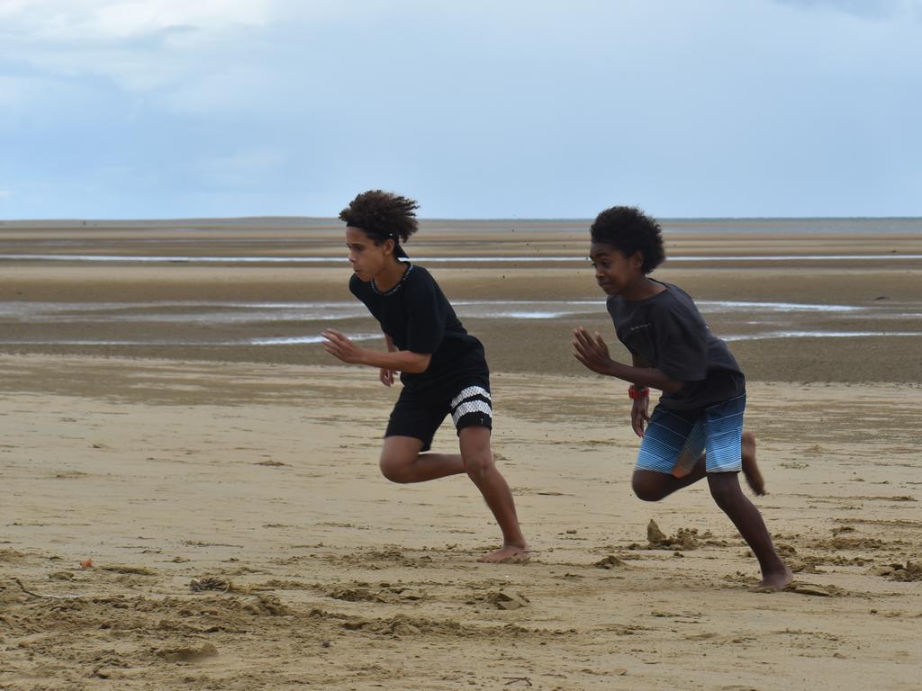 Harper Davis and Esaias Woyse racing for the flag at the Mackay & District South Sea islander Association's 2022 Australia Day Celebrations in Quota Park. Picture: Lillian Watkins