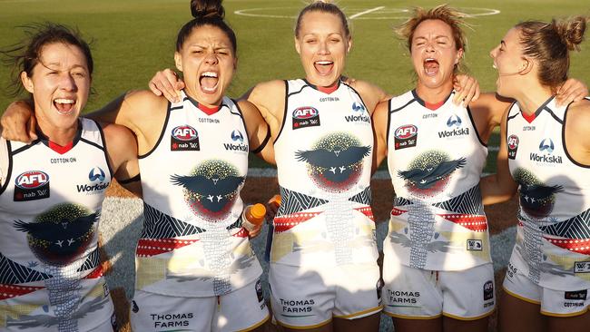 Crows players sing the team song after their resounding win over Melbourne. Picture: Daniel Pockett.