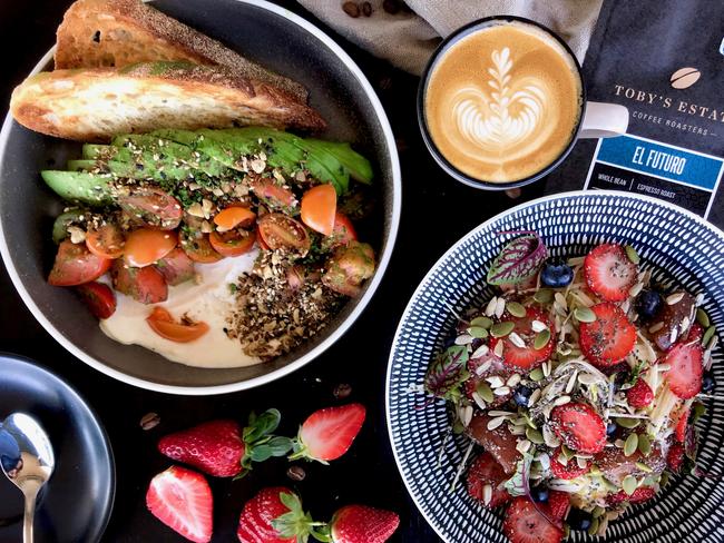 Toby’s Estate’s flat white with El Futuro coffee blend, avocado toast and Bircher muesli. Picture: Jenifer Jagielski