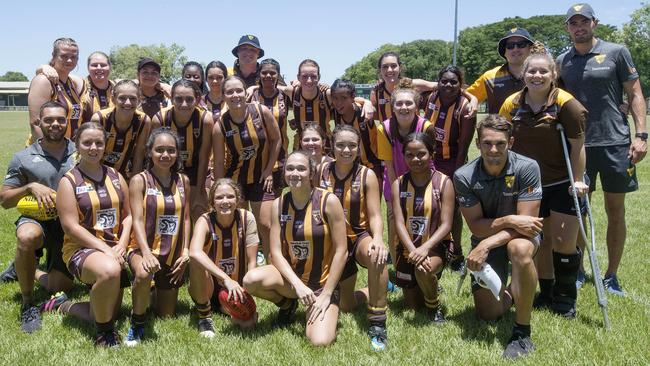 Hawthorn’s Jarman Impey, Connor Nash and Mathew Walker with the Big River Hawks girls team. Picture: Michael Klein