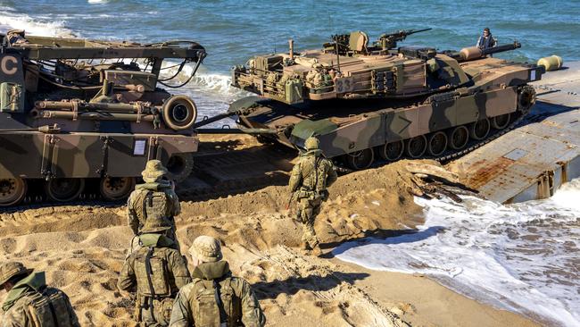 Soldiers from the Australian Amphibious Force use an M88 Recovery Vehicle to drive an M1A1 Abrams onto a MEXEFLOTE in a recovery scenario. Photo: CAPT Annie Richardson