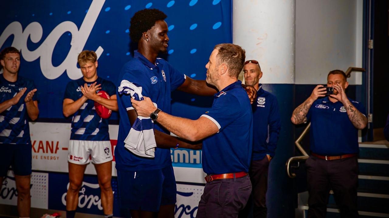 Ajang Kuol mun receives his jumper ahead of his debut. Picture: Arj Giese