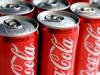 A stock image of cans of Coca Cola