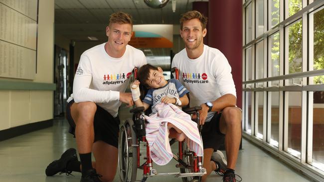 GWS Giants players visited the Starlight Room at The Children's Hospital at Westmead today. Pictured is (left) Adam Tomlinson, Luke Nikolic 4, and Matt de Boer. Picture: David Swift.