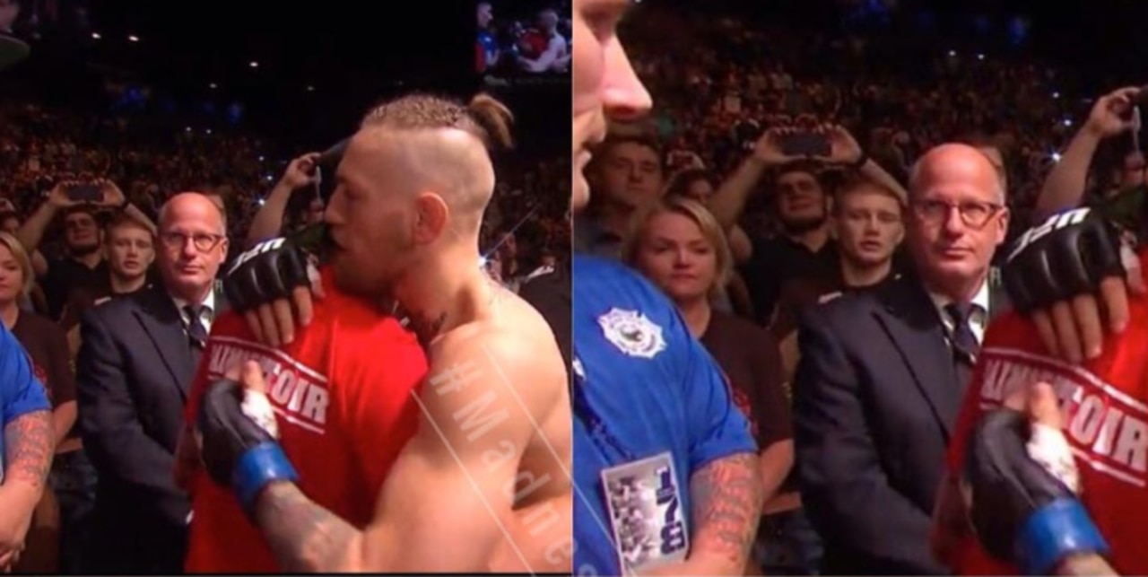 Khabib takes snaps of Conor McGregor at UFC 178.
