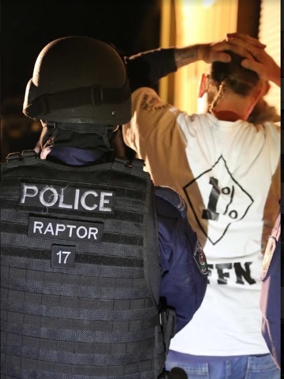 A Raptor officer arresting a member of the Nomads outlaw motorcycle gang. The gang is currently recruiting heavily to boost its numbers.