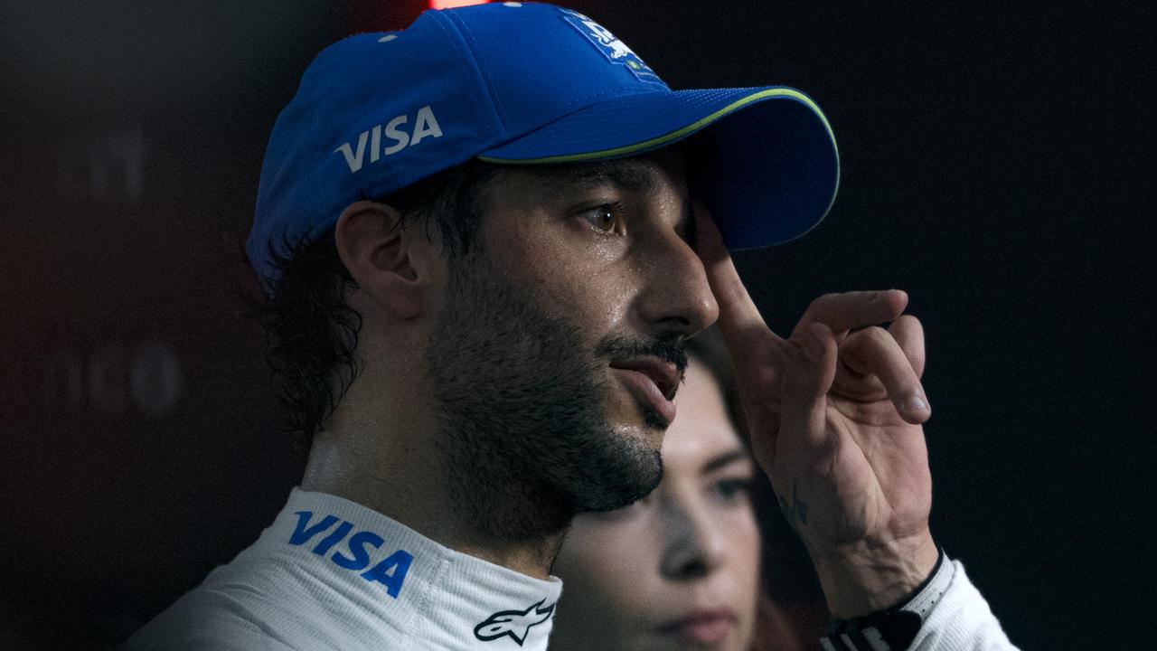 SINGAPORE, SINGAPORE - SEPTEMBER 21: 16th placed qualifier Daniel Ricciardo of Australia and Visa Cash App RB talks to the media in the Paddock during qualifying ahead of the F1 Grand Prix of Singapore at Marina Bay Street Circuit on September 21, 2024 in Singapore, Singapore. (Photo by Rudy Carezzevoli/Getty Images)