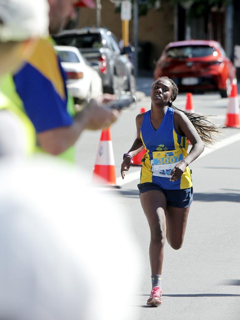 Women's 3km event winner Metasebia Duggan, 13, crosses the finish line in the Race to the Taste. Picture: PATRICK GEE