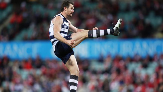 Patrick Dangerfield kicks a ‘waxy’ Sherrin. Picture: Mark Metcalfe/AFL Photos/via Getty Images